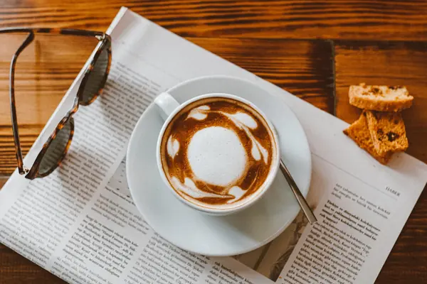 Latte on a folded newspaper for the guide on USA Today press release cost